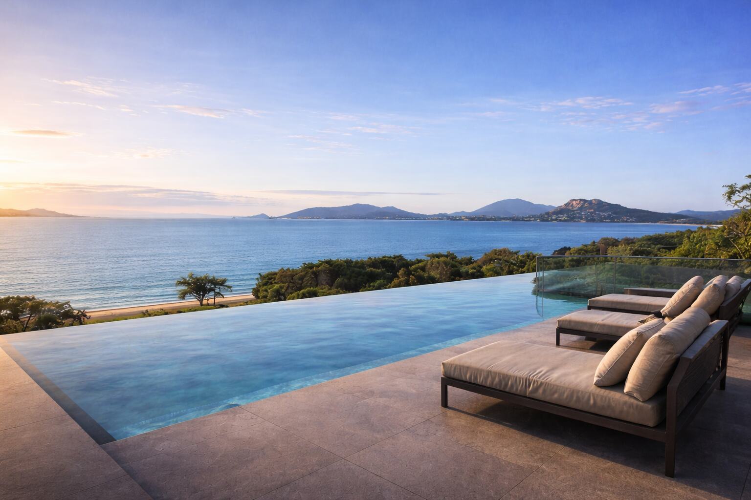 Infinity pool edge above the beach and bay