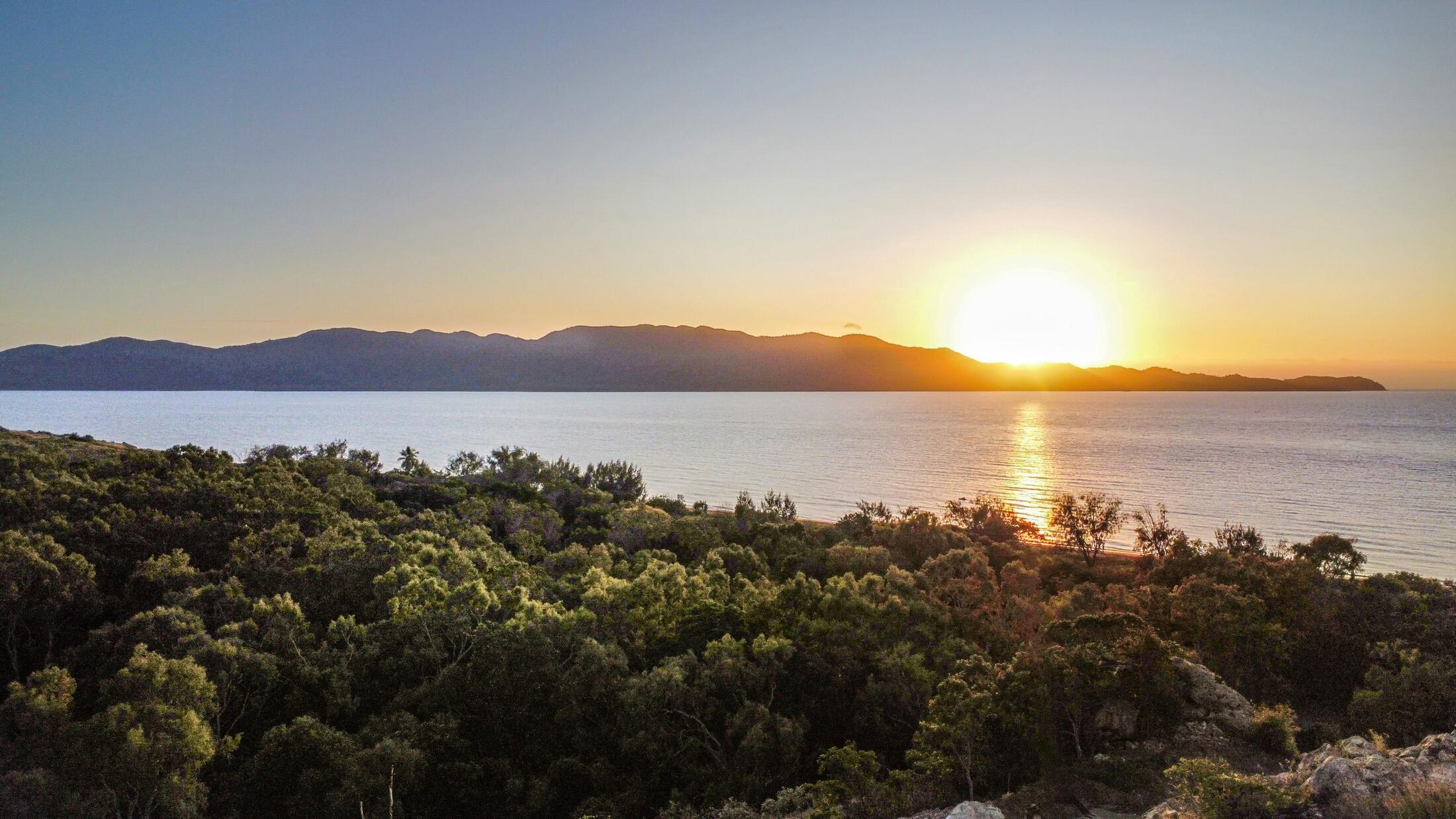 The sun rising behind Magnetic Island, seen from the escarpment